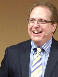 Tom smiling looking left - 400x600