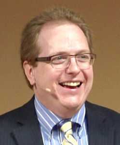 tom smiling on stage head only